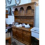 Pine dresser with 3 cupboards and 3 drawers under,