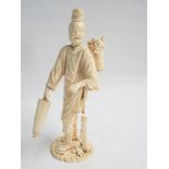 Large 19th century carved ivory Japanese figure depicting a merchant with a basket full of octopus