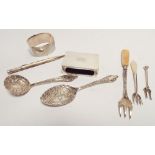 A collection of small silver ware to include matchbox cover, napkin ring, propelling pencil,