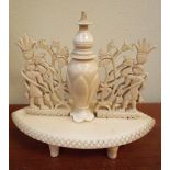 19th century carved ivory table snuff bottle on oval base, height 13 cms, width 14 cms.