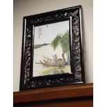 Japanese porcelain panel of fishing scene in a carved hardwood frame,