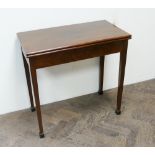 A Georgian mahogany folding top tea table on square taper legs with spade feet 2'6 wide