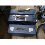 3 blue vintage suitcases
