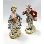 Pair of continental porcelain figurines in 18th century dress