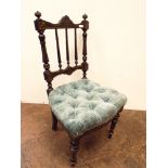 A late Victorian ebonised stick back occasional chair with blue buttoned upholstered seat