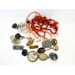 Large collection of costume jewellery, brooches, faux coral etc.