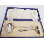 Hallmarked silver sugar pusher and spoon set,