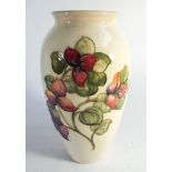 Large Moorcroft vase decorated with Bougainvillea on a cream ground,