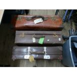 3 brown vintage suitcases