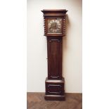 A 1920/30's chiming Grandfather clock in oak case with barley twist columns with a brass and silver