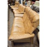 A pair of 2 seater Stress Less settee's in a pale brown leather and 1 matching chair