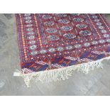 Red and patterned Bokhara rug,
