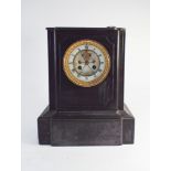 A late Victorian striking mantle clock in black marble case