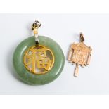 Chinese lantern 14k gold pendant and a jade set circular pendant