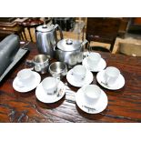 Four piece old hall stainless steel teaset and 6 Limoges coffee cups and saucers