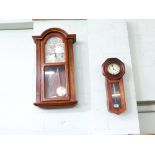 Two wall hanging clocks