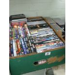 Large box of DVDs and 3 box sets of DVDs