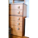 Five drawer teak chest of drawers matching the previous lot