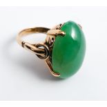 Chinese jade and gold ring, set with a large oval cabochon jade of good colour, shank stamped 18K,