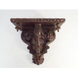 Carved oak wall bracket