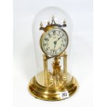 A brass 400 day clock under dome