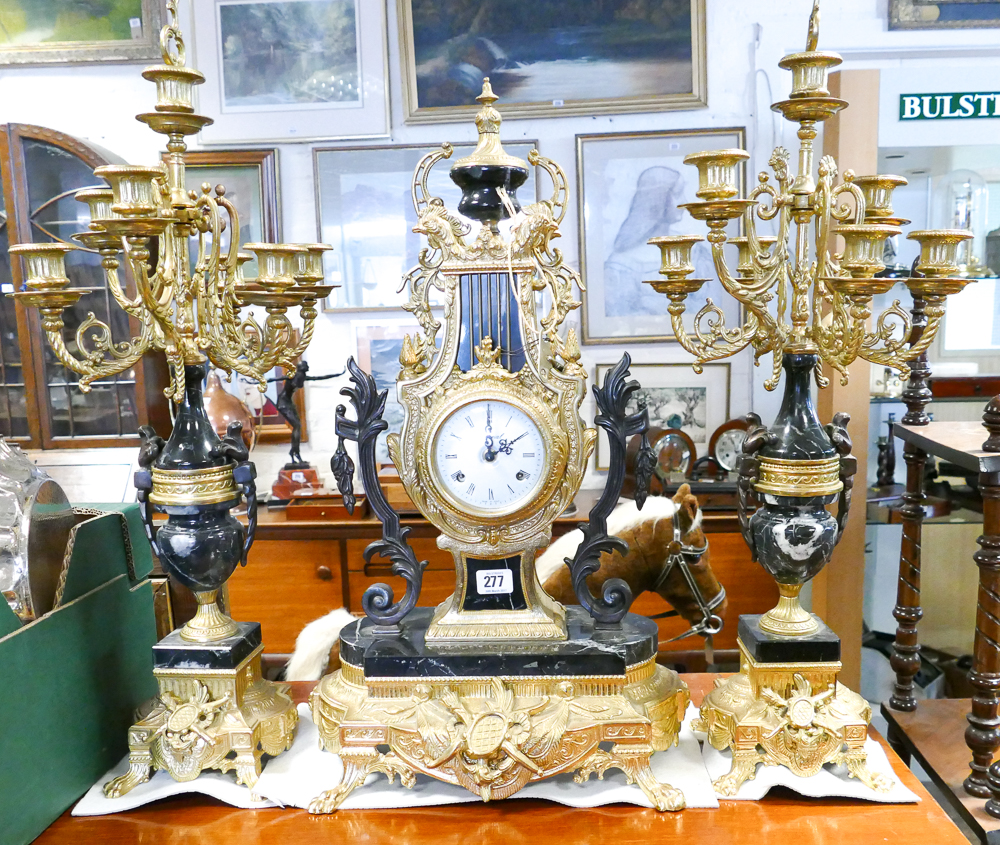 Reproduction French gilt and black marble 3 piece clock garniture