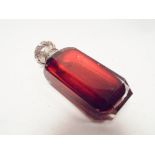 A ruby glass Victorian scent bottle with white metal hinge lid possible old