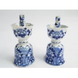 Pair of early 19th century Chinese blue and white candlesticks decorated with birds nesting against