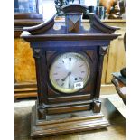 An Edwardian striking bracket clock in oak case