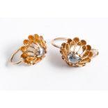 A pair of diamond pierced drop earrings set in a yellow gold flower cage like mount