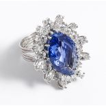 A very large sapphire and diamond cluster ring set in white gold ring size 'O'