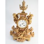 19th century striking French mantel clock in gilded ormolu case decorated with cherubs and pink