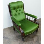 A Victorian mahogany framed elbow chair upholstered in buttoned green dralon