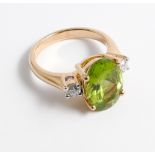 An 18ct yellow gold peridot and diamond ring set with an oval mixed cut peridot of approx 5cts