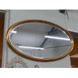 Large oval bevelled edge gilt framed mirror