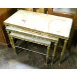 A nest of three brass framed onyx topped coffee tables