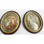 Pair of 19th century oval miniatures on ivory in decorative black and gilt reverse painted glass