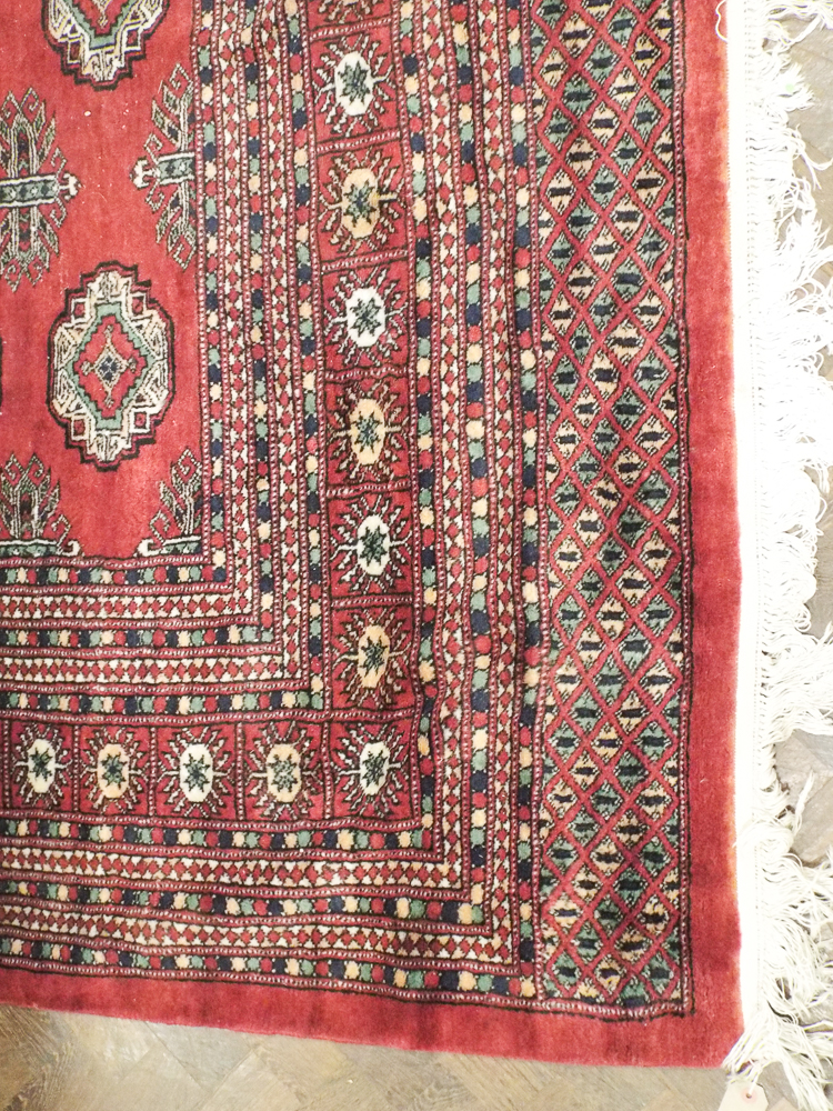 Large red and patterned Bokhara rug approx 13' x 10'