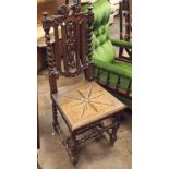 A Victorian carved oak hall chair with panel seat (Shaky)