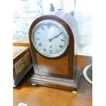 An Edwardian dome topped mantle clock in inlaid mahogany case