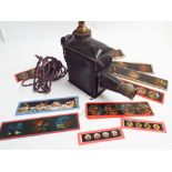 Old magic lantern and a selection of slides to include nursery rhymes, Old Mother Hubbard,