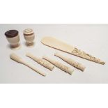 A collection of the turn of the century ivory to include shoe horn,