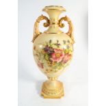 A Royal Worcester blush ivory twin handled vase painted with floral sprays number to base 2443