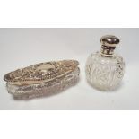 1930's hallmarked silver mounted cut glass scent bottle with hinged lid and a shaped oval cut glass