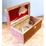 A Victorian mahogany tea caddy has the glass mixing bowl but nothing else