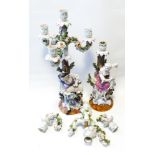 Pair of Augustus Rex Dresden flower encrusted figural candlestick table centrepieces with damage