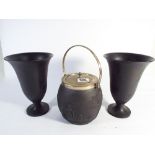 Wedgwood black basalt biscuit barrel with silver plated lid and mounts and a pair of black basalt