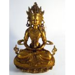 Gilded brass seated model of Anatayus 30cm tall