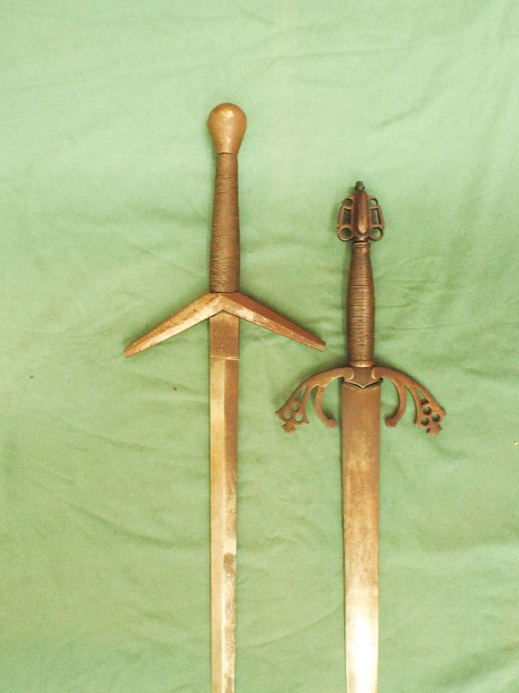 2 reproduction Viking or medieval swords each about 45" long