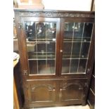 A 3'6 reproduction oak leaded glazed bookcase with cupboards under